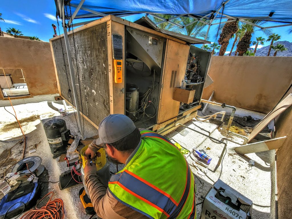 Engineer doing an Emergency AC Replacement